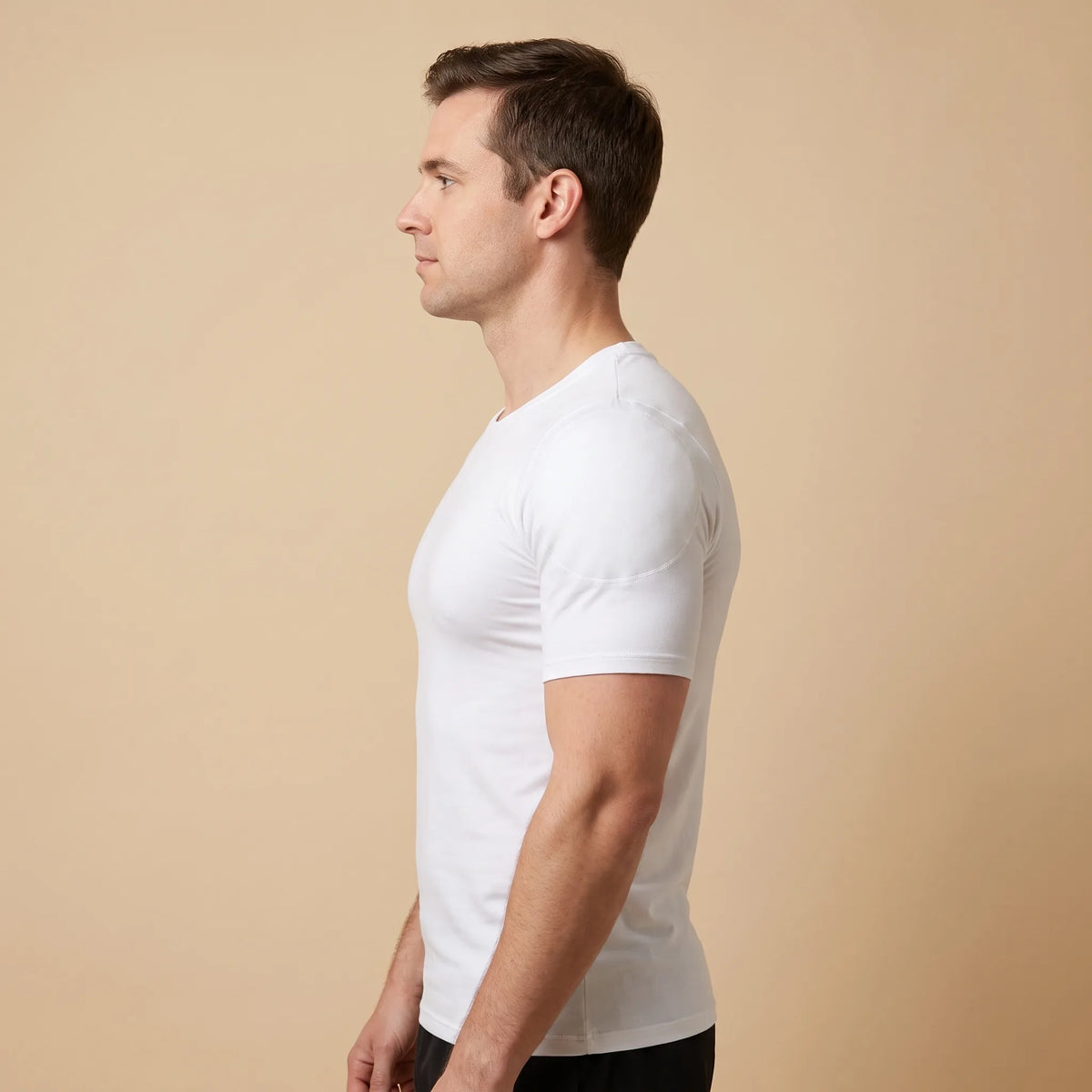 Man wearing the white V-Frame Padded Undershirt, side profile