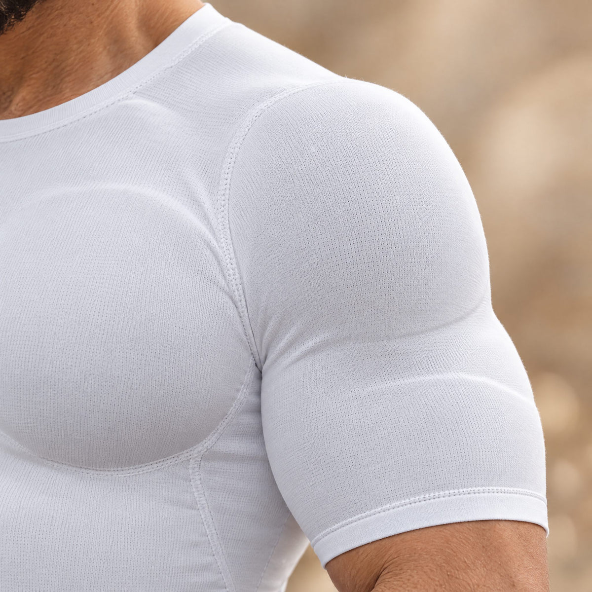 Close-up of the padded shoulder and sleeve of the white V-Frame undershirt