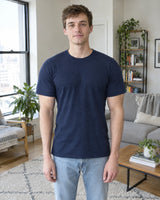 After: same man and navy T-shirt, with the V-Frame Padded Undershirt underneath